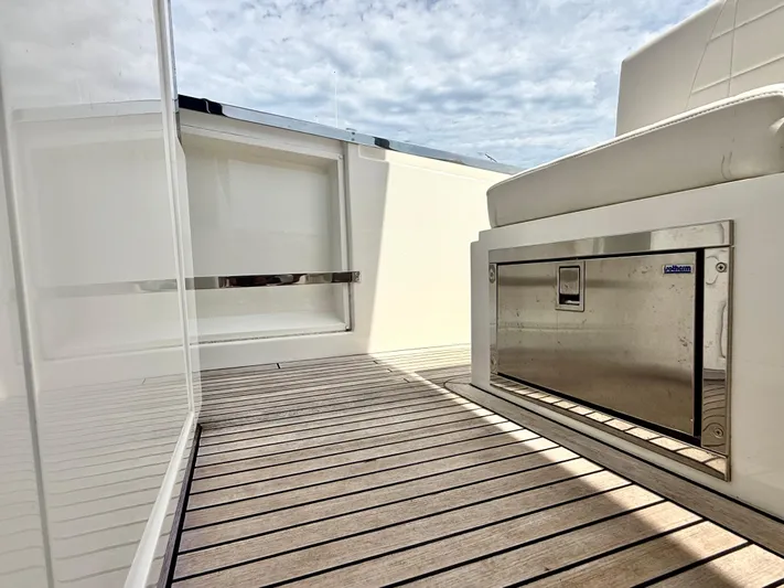  Yacht Photos Pics 2023 Astondoa 377 Coupe Outboard interior with sleek design and wooden flooring.