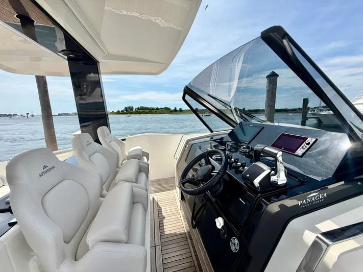  Yacht Photos Pics 2023 Astondoa 377 Coupe Outboard helm with luxurious seating and modern controls.