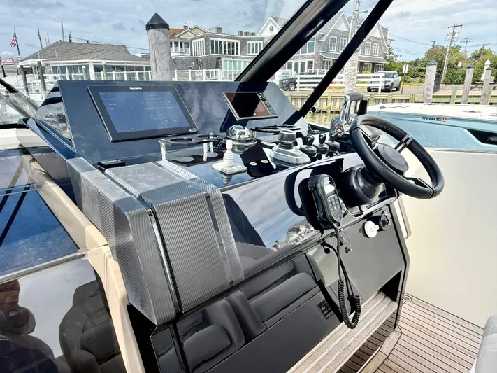  Yacht Photos Pics 2023 Astondoa 377 Coupe Outboard helm with modern controls and navigation display.