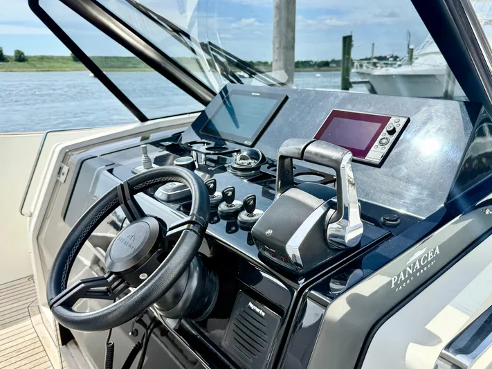  Yacht Photos Pics 2023 Astondoa 377 Coupe Outboard helm with modern controls and navigation screens.