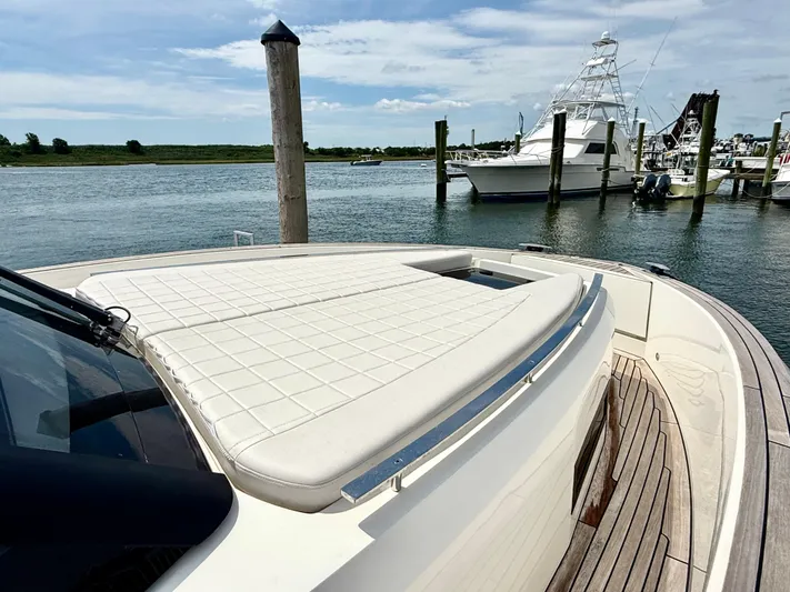  Yacht Photos Pics 2023 Astondoa 377 Coupe Outboard yacht with sunpad, docked in a marina.