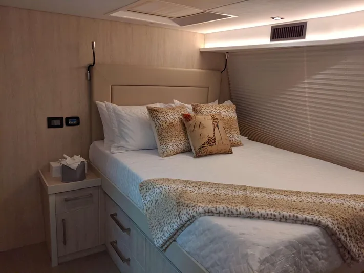  Yacht Photos Pics Luxurious bedroom in 2019 Leopard 58 yacht with elegant bedding and decor.