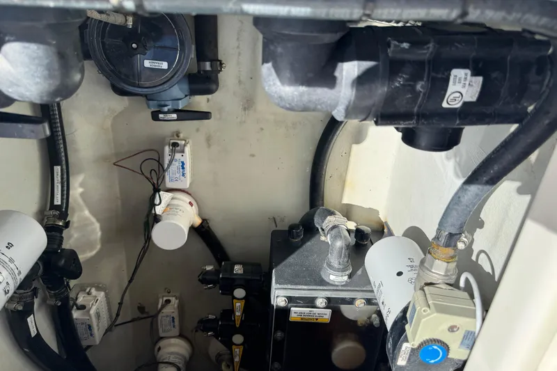  Yacht Photos Pics 2023 SeaVee 340Z engine compartment with various mechanical components and hoses.