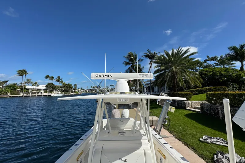  Yacht Photos Pics 2023 SeaVee 340Z boat docked by palm trees, featuring Garmin xHD2 radar.