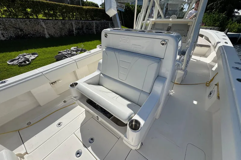  Yacht Photos Pics 2023 SeaVee 340Z boat interior with cushioned seating and control panel.