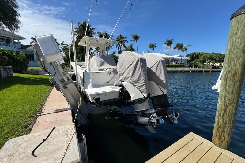  Yacht Photos Pics 2023 SeaVee 340Z boat docked, covered engines, sunny waterfront setting.