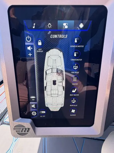  Yacht Photos Pics 2024 Malibu M242 boat control panel displaying various system settings and features.
