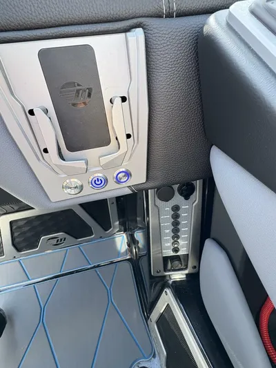  Yacht Photos Pics 2024 Malibu M242 interior detail with sleek controls and modern design elements.