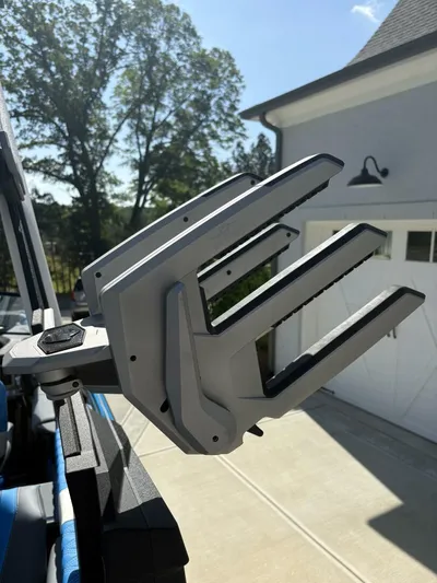  Yacht Photos Pics 2024 Malibu M242 boat accessory in a sunny driveway setting.