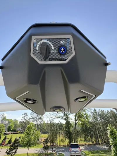  Yacht Photos Pics 2024 Malibu M242 boat control panel with blue power button, outdoor setting.