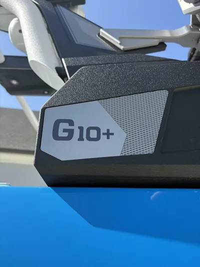  Yacht Photos Pics Close-up of 2024 Malibu M242 G10+ feature on a blue surface.