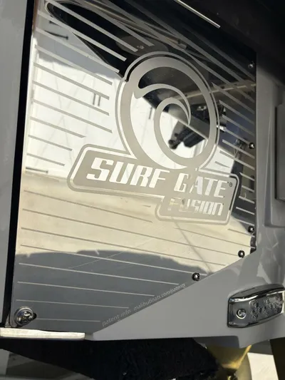  Yacht Photos Pics 2024 Malibu M242 Surf Gate Fusion detail on boat exterior.