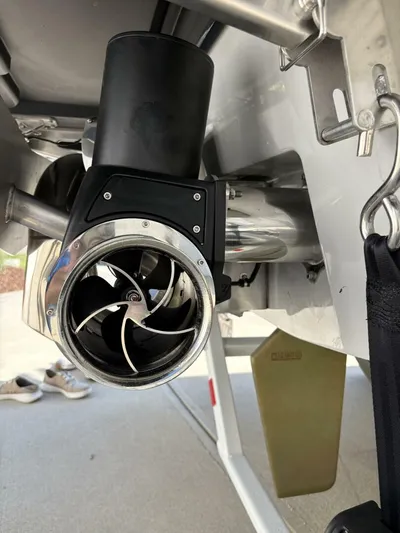  Yacht Photos Pics 2024 Malibu M242 boat propeller and exhaust system close-up.