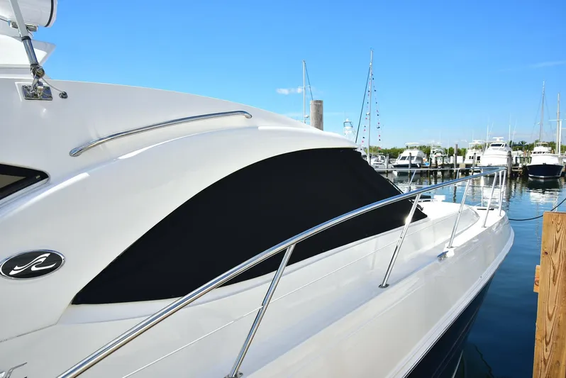 Cay IV Yacht Photos Pics 2013 Sea Ray 410 Sundancer yacht docked at marina, sleek design, sunny day.