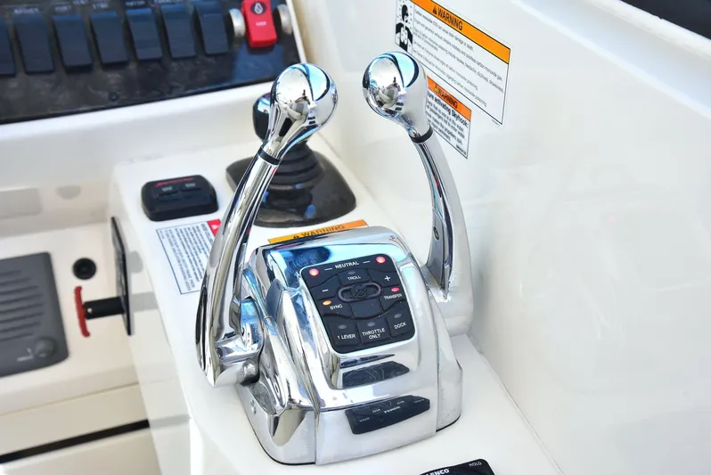 Cay IV Yacht Photos Pics Chrome throttle controls on 2013 Sea Ray 410 Sundancer boat dashboard.