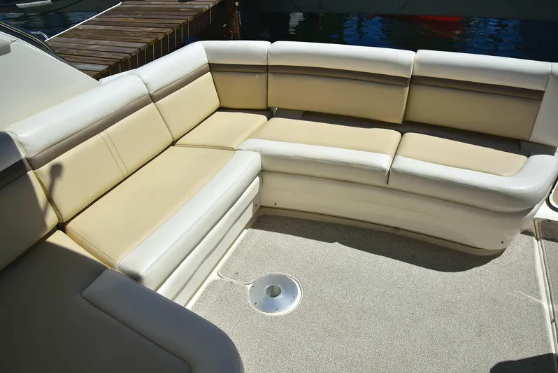 Cay IV Yacht Photos Pics Luxurious seating area on 2013 Sea Ray 410 Sundancer yacht, featuring beige upholstery.