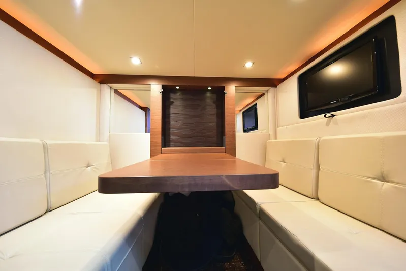 Cay IV Yacht Photos Pics Luxurious interior of 2013 Sea Ray 410 Sundancer yacht with plush seating and modern amenities.