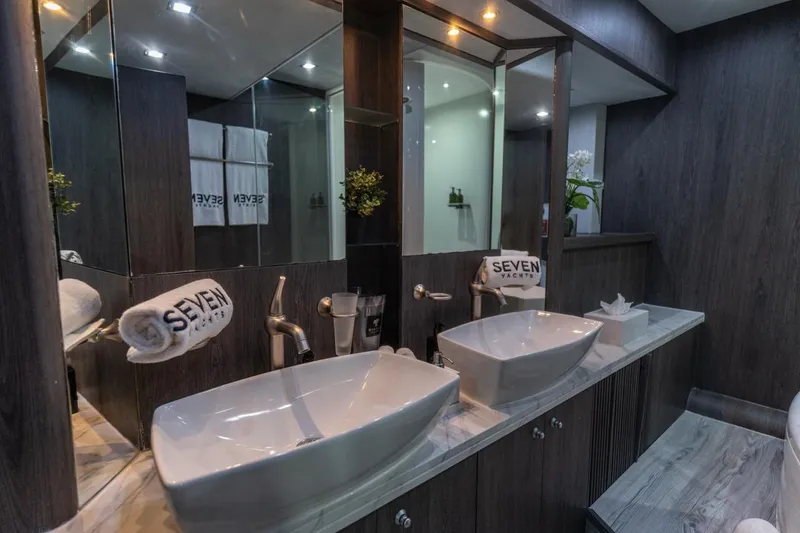 The Matrix Yacht Photos Pics Luxurious bathroom interior on a 2007 Sunseeker 82 Yacht, featuring dual sinks and elegant decor.