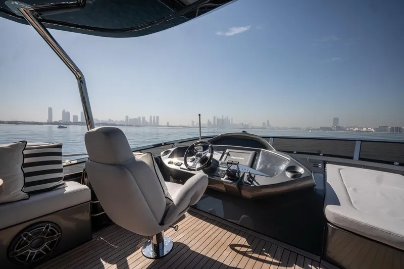 The Matrix Yacht Photos Pics Luxurious 2007 Sunseeker 82 Yacht helm with city skyline view.