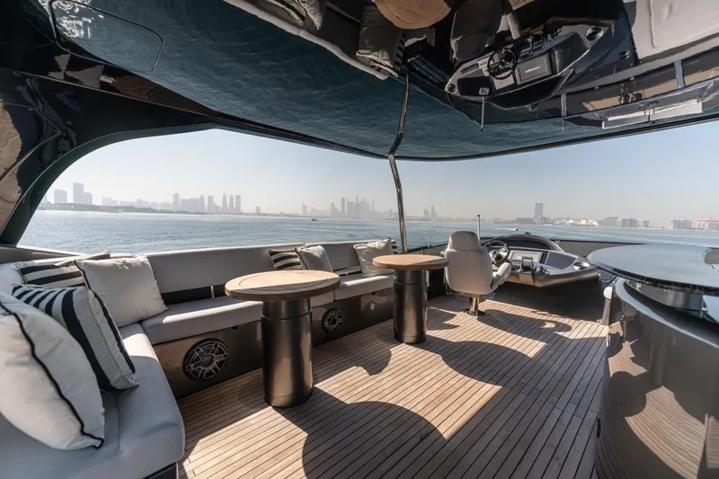 The Matrix Yacht Photos Pics Luxurious 2007 Sunseeker 82 Yacht interior with city skyline view, featuring elegant seating and helm.