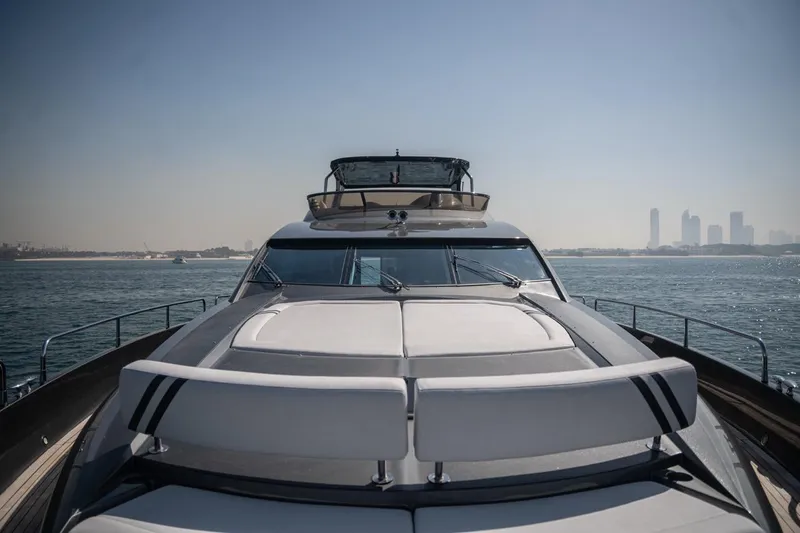 The Matrix Yacht Photos Pics 2007 Sunseeker 82 Yacht cruising on open water with city skyline in background.