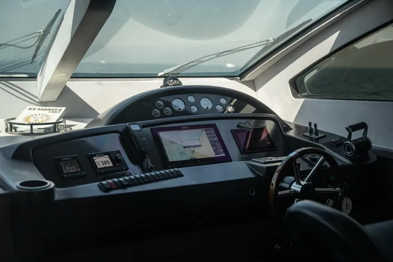 The Matrix Yacht Photos Pics Cockpit of 2007 Sunseeker 82 Yacht with navigation equipment and steering wheel.