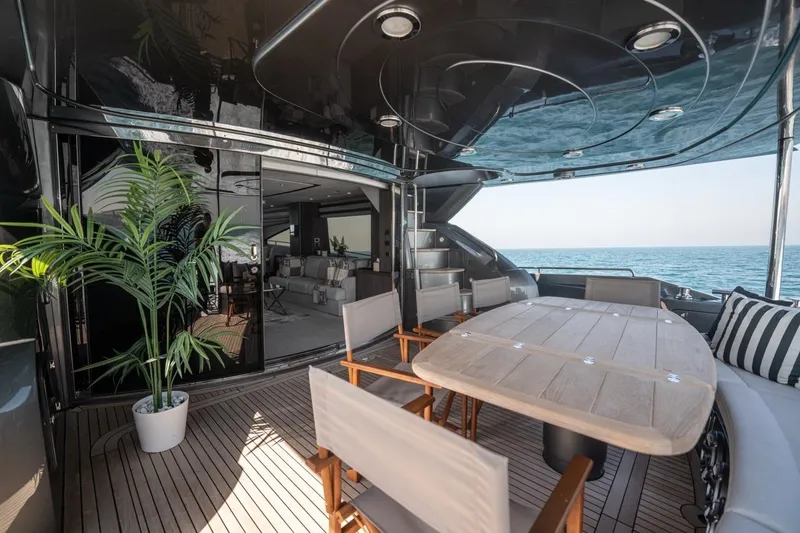 The Matrix Yacht Photos Pics Luxurious 2007 Sunseeker 82 Yacht deck with elegant dining area and ocean view.