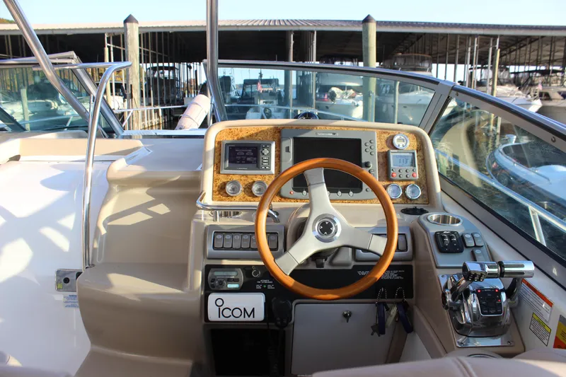  Yacht Photos Pics 2008 Formula 34 Cruiser helm with wood-accented dashboard and modern navigation controls.
