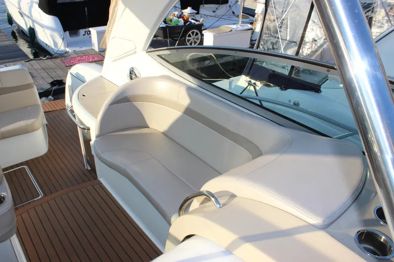 Yacht Photos Pics 2008 Formula 34 Cruiser interior with beige seating and wood flooring.