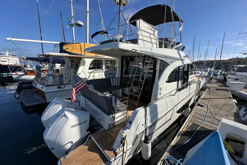 Vitamin Sea Yacht Photos Pics 2023 Beneteau Antares 11 Fly yacht docked at marina with Mercury engines.