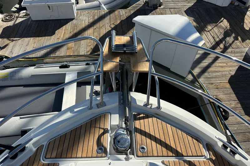 Vitamin Sea Yacht Photos Pics Bow view of 2023 Beneteau Antares 11 Fly with teak decking and stainless steel railings.