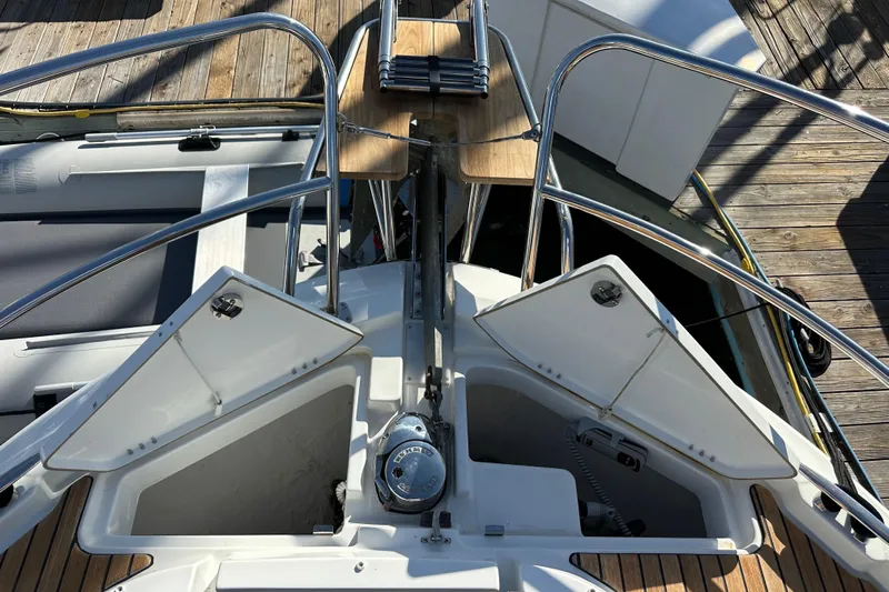Vitamin Sea Yacht Photos Pics 2023 Beneteau Antares 11 Fly boat deck with open storage compartments and railing.
