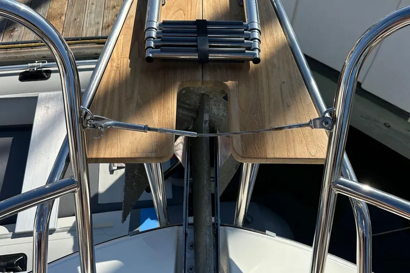 Vitamin Sea Yacht Photos Pics Bow view of 2023 Beneteau Antares 11 Fly with anchor and wooden deck detail.