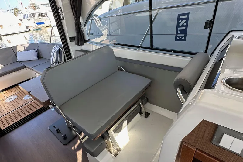 Vitamin Sea Yacht Photos Pics Interior of 2023 Beneteau Antares 11 Fly, featuring seating and modern design elements.