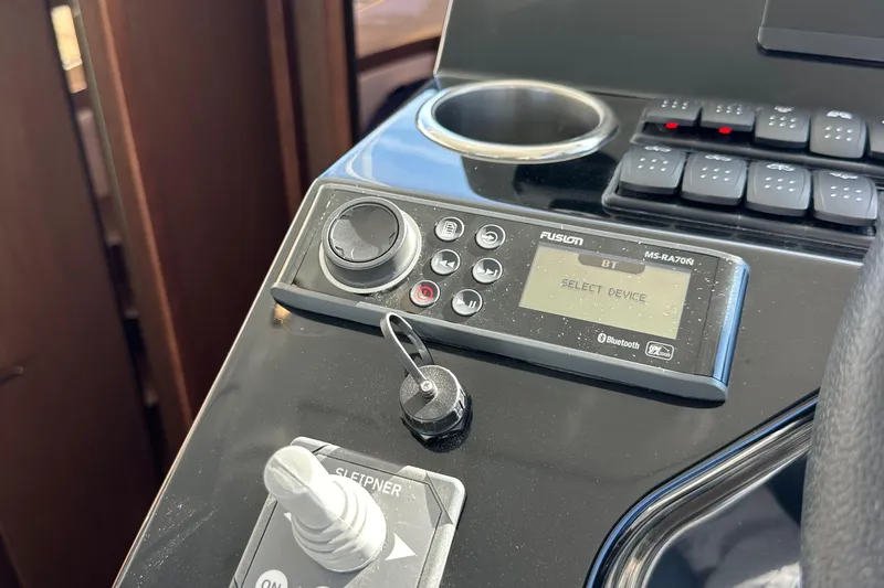 Vitamin Sea Yacht Photos Pics Control panel of 2023 Beneteau Antares 11 Fly with Fusion MS-RA70N audio system.