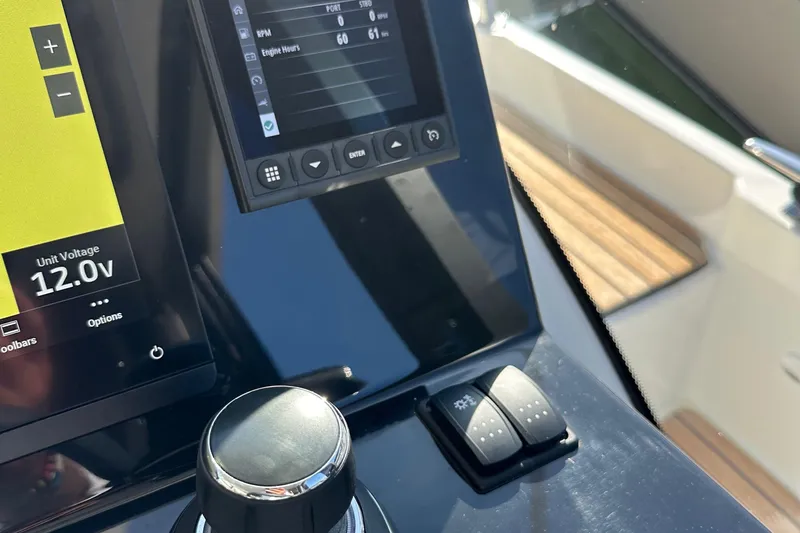 Vitamin Sea Yacht Photos Pics Control panel of 2023 Beneteau Antares 11 Fly, displaying unit voltage and engine hours.