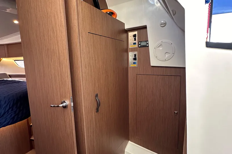 Vitamin Sea Yacht Photos Pics Interior of 2023 Beneteau Antares 11 Fly, featuring wood paneling and cabin access.