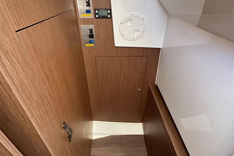 Vitamin Sea Yacht Photos Pics Interior of 2023 Beneteau Antares 11 Fly, featuring wood paneling and control panels.