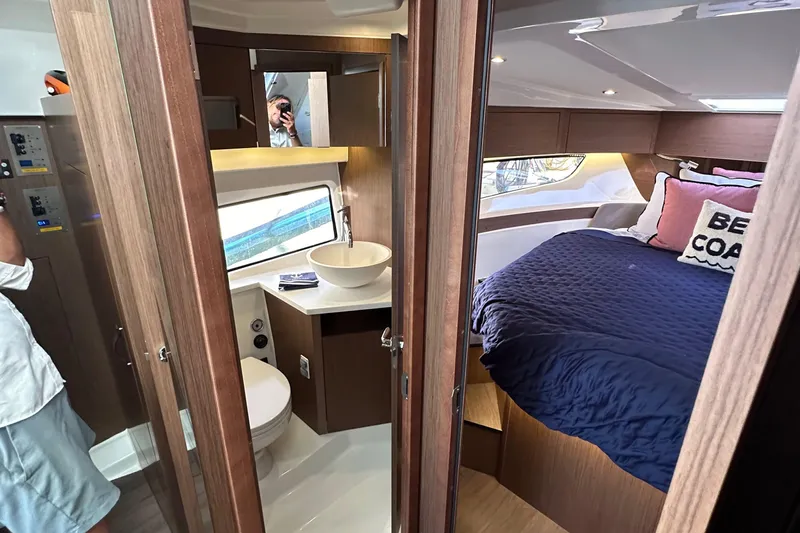 Vitamin Sea Yacht Photos Pics 2023 Beneteau Antares 11 Fly interior with cozy bedroom and modern bathroom.