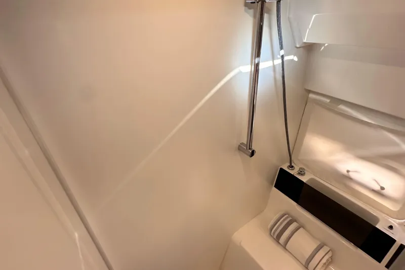 Vitamin Sea Yacht Photos Pics 2023 Beneteau Antares 11 Fly bathroom with modern shower and sleek design.