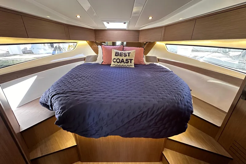 Vitamin Sea Yacht Photos Pics Luxurious cabin interior of 2023 Beneteau Antares 11 Fly with cozy bedding.