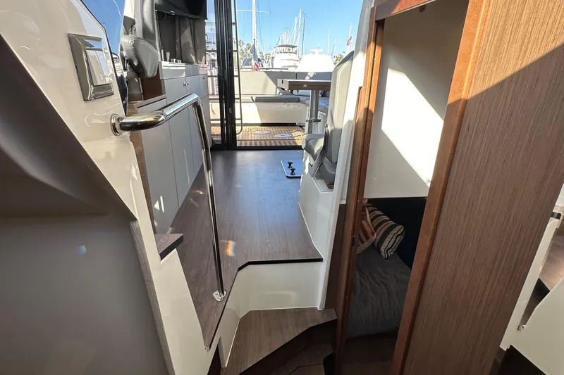 Vitamin Sea Yacht Photos Pics Interior view of 2023 Beneteau Antares 11 Fly, showcasing modern design and wood finishes.