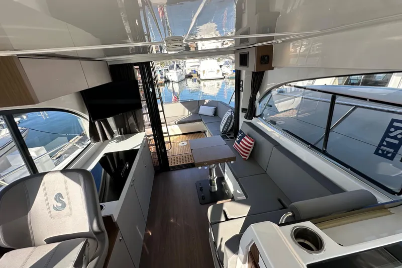 Vitamin Sea Yacht Photos Pics Interior of 2023 Beneteau Antares 11 Fly, featuring modern seating and sleek design.