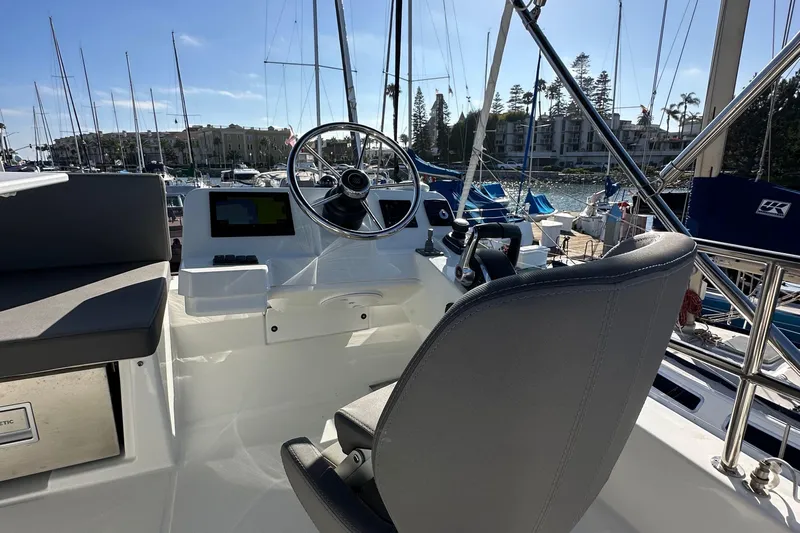 Vitamin Sea Yacht Photos Pics 2023 Beneteau Antares 11 Fly helm with steering wheel and navigation screens.
