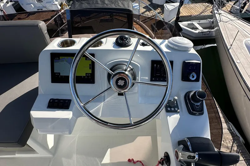 Vitamin Sea Yacht Photos Pics 2023 Beneteau Antares 11 Fly helm with modern controls and navigation displays.