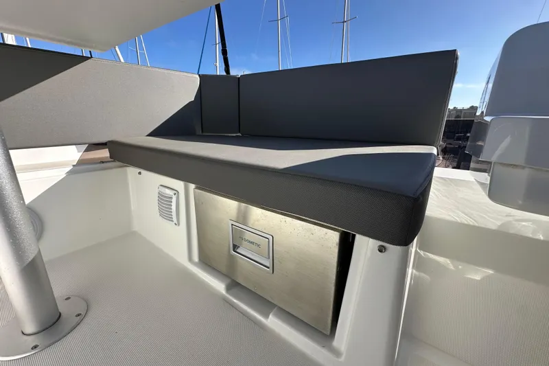 Vitamin Sea Yacht Photos Pics 2023 Beneteau Antares 11 Fly seating area with integrated storage and modern design.