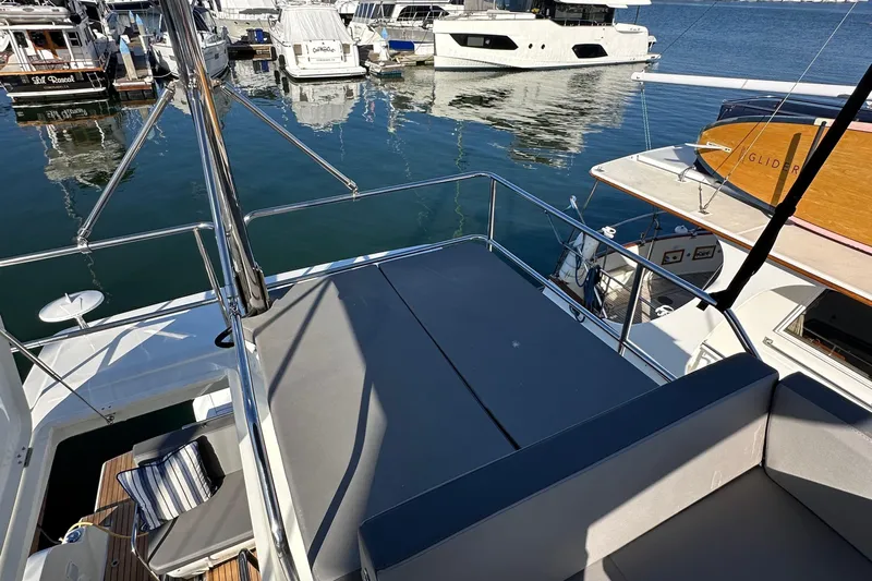 Vitamin Sea Yacht Photos Pics Flybridge view of 2023 Beneteau Antares 11 Fly yacht docked at marina.