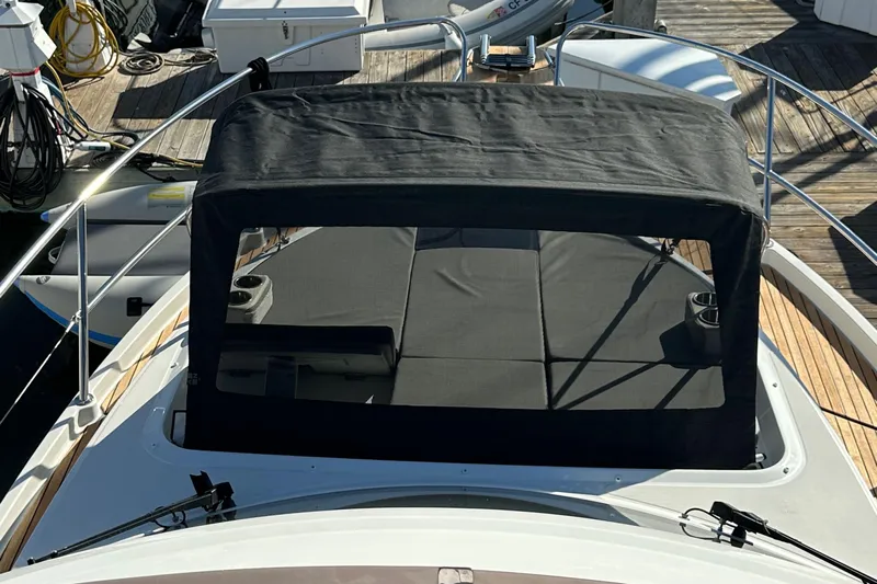 Vitamin Sea Yacht Photos Pics 2023 Beneteau Antares 11 Fly with covered seating area on deck.