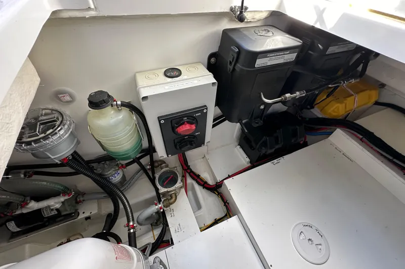 Vitamin Sea Yacht Photos Pics Engine compartment of 2023 Beneteau Antares 11 Fly, showcasing wiring and components.