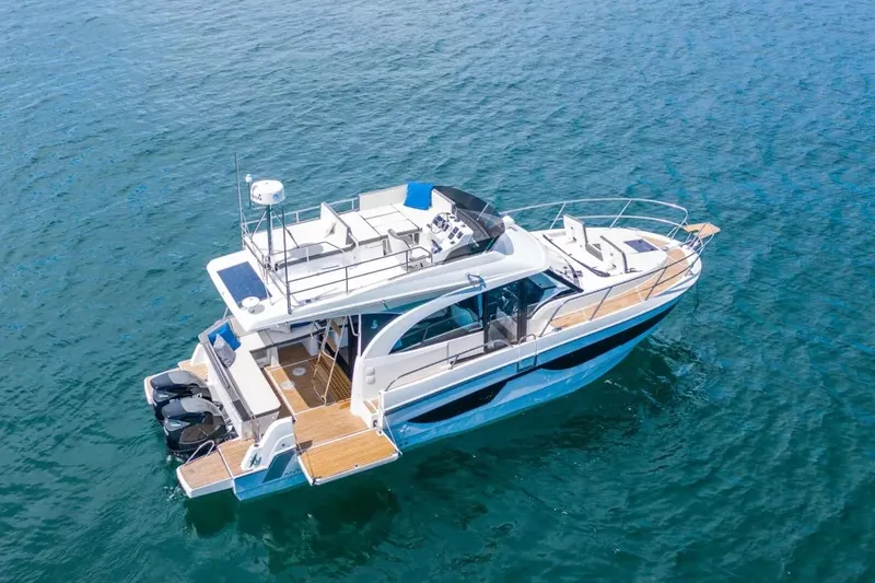 Vitamin Sea Yacht Photos Pics 2023 Beneteau Antares 11 Fly yacht on open water, aerial view.